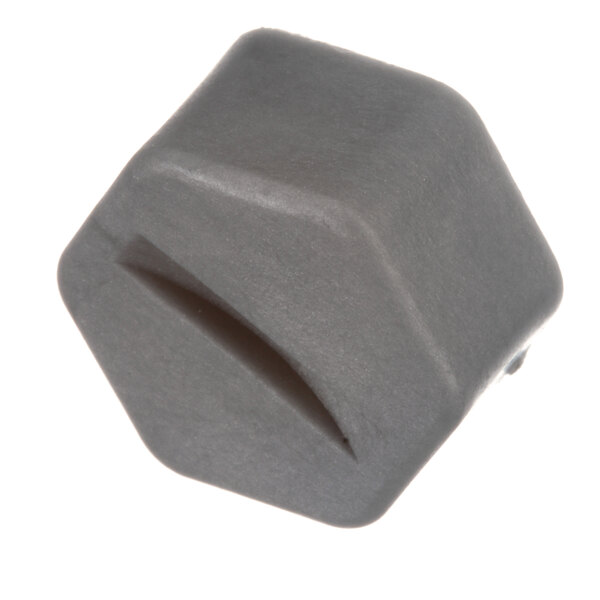 A grey hexagon-shaped plastic plug with a hole in it.