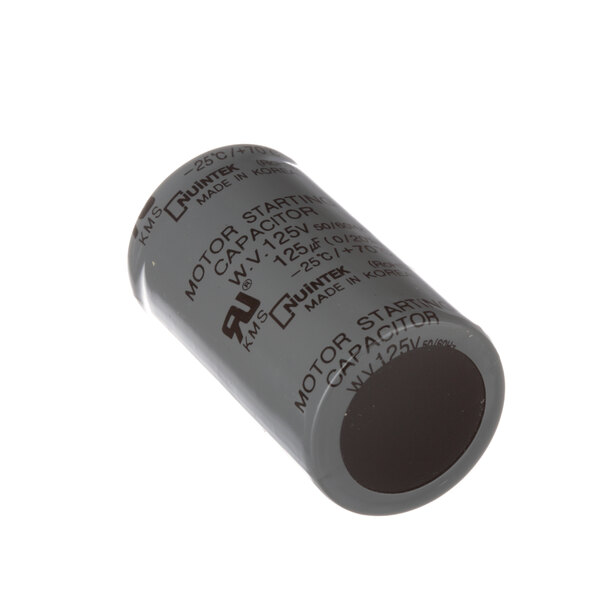 A close-up of a grey Turbo Air Refrigeration start capacitor with black text.