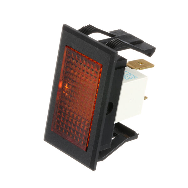 A close-up of a light amber Keating switch with black and orange details.