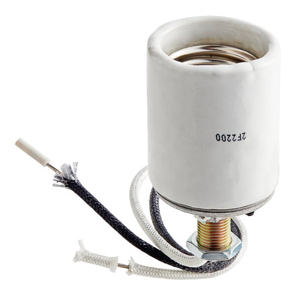 A white ceramic cylinder with black wires.