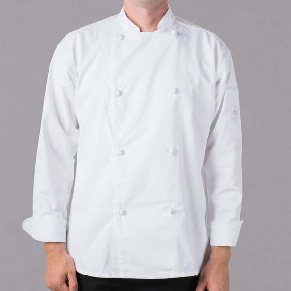 A man wearing a white Mercer Culinary chef jacket with cloth knot buttons.