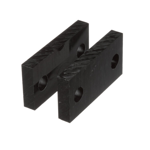 Two black plastic Cleveland pad insulators with holes.