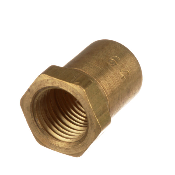A close-up of a brass nut with a screw on the end.