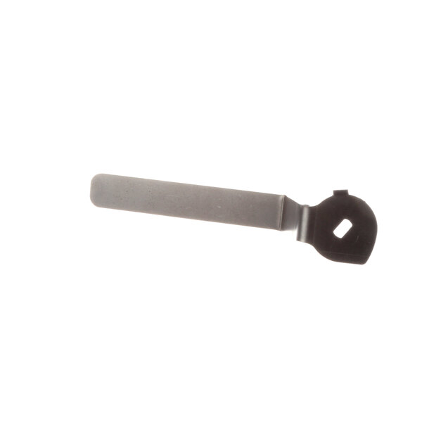 A close-up of a grey rectangular metal tool with a handle.