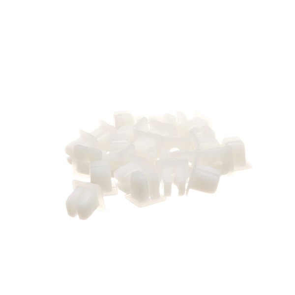 A pile of white plastic Ice-O-Matic nuts.