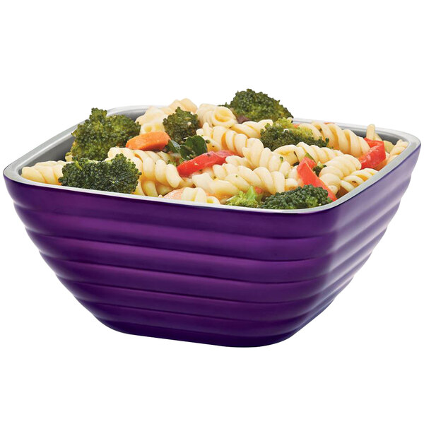 A Passion Purple Vollrath beehive serving bowl filled with pasta and broccoli.