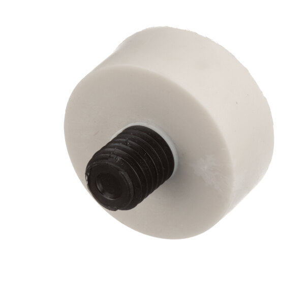 A white round rubber foot with a black screw.