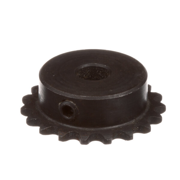 A close-up of a black metal Frymaster sprocket with holes.