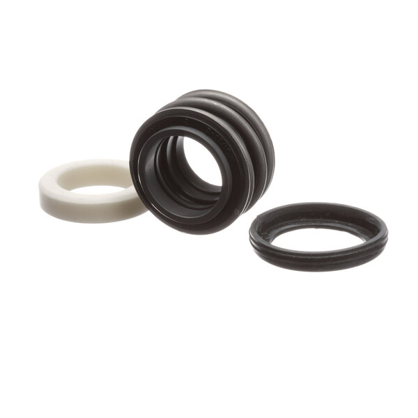 A black and white rubber pump seal kit with different sizes of round seals and a white ring with a hole.