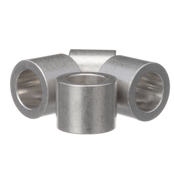 A group of three cylindrical metal bushings.