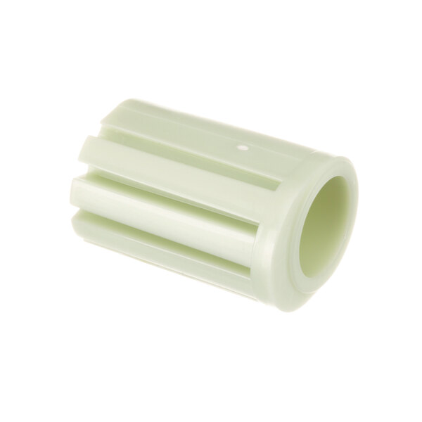 A close-up of a green plastic and white object with a white cap.
