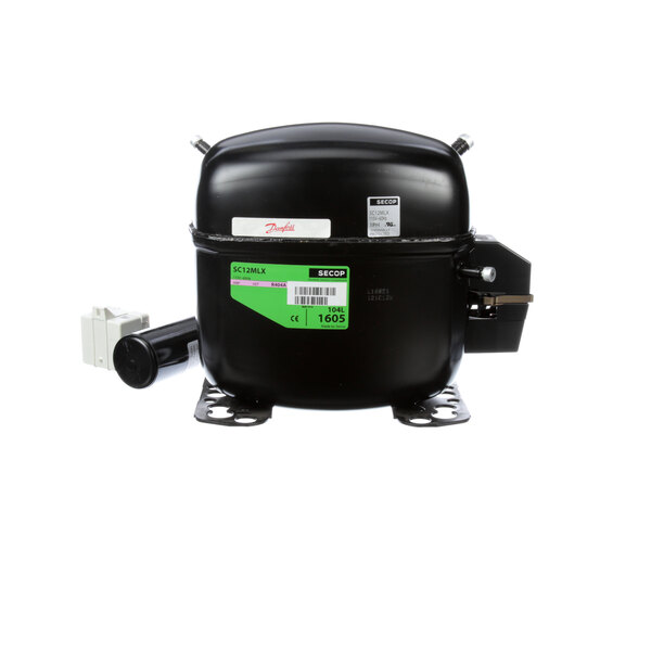 A black Manitowoc Ice compressor with a green label.