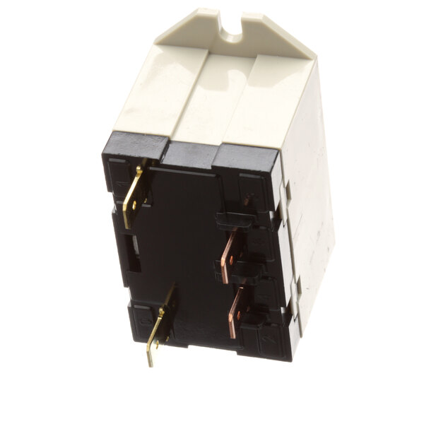 A small black and white electrical relay with a white background.