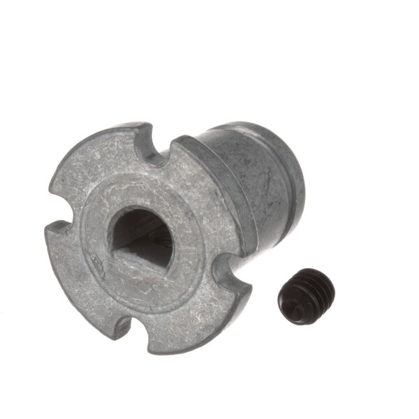 A metal nut and screw on a metal object with a screw.