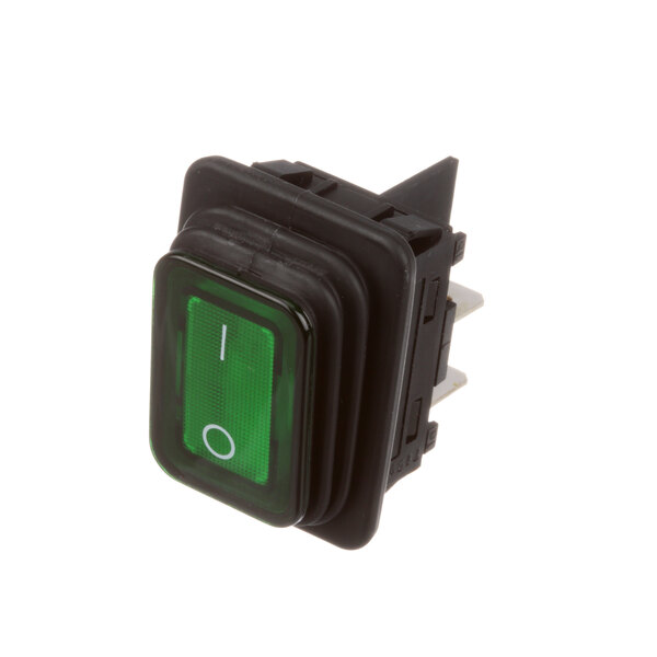 A close-up of a green rectangular Dinex lighted rocker switch.