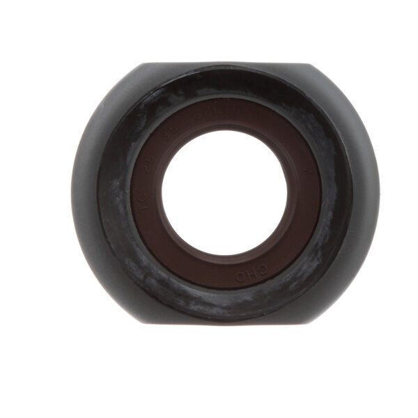 A black circular seal with a hole in the center.