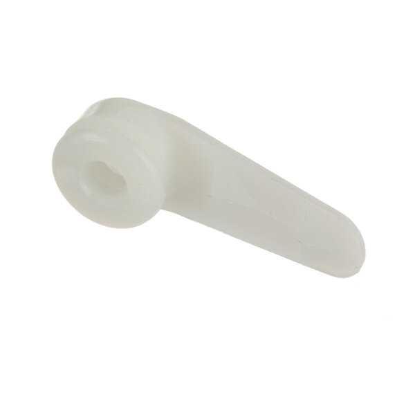 A close-up of a white plastic spindle holder with a hole in it.