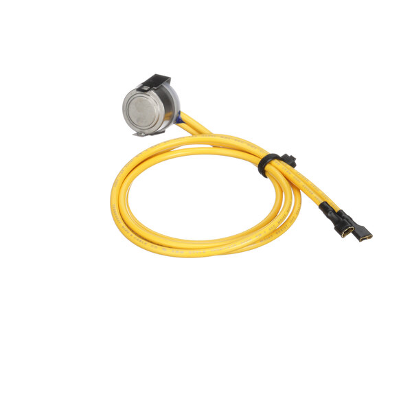 A yellow cable with a black connector on a Traulsen fan delay.