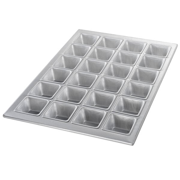 A silver Chicago Metallic square muffin pan with 24 square compartments.