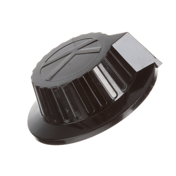 A black plastic Keating T-Stat knob with a cross on it.