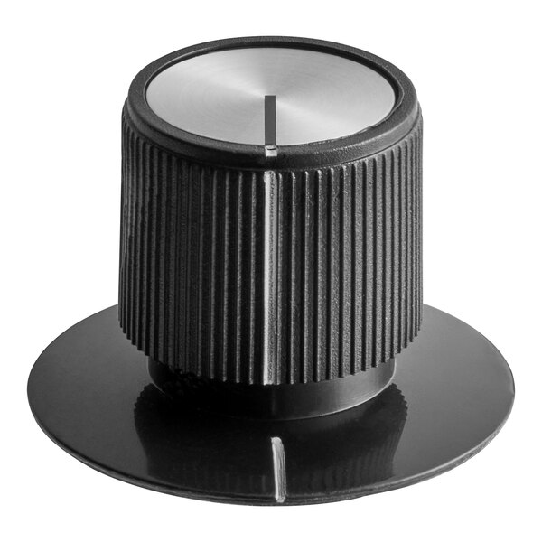 A close-up of a black and silver Hatco knob.