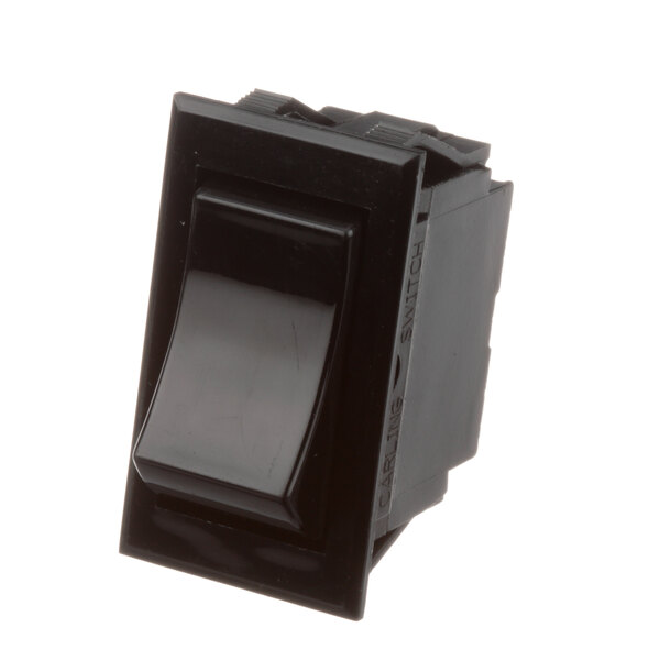 A close-up of a black Southbend momentary light switch with a black cover.