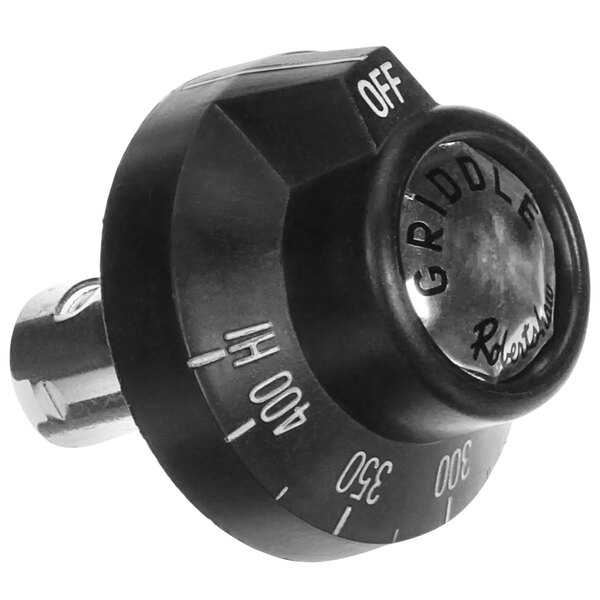 A black knob with white text on a round knob.