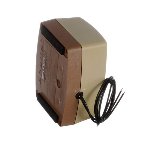 A brown and tan Somat air pump with wires.
