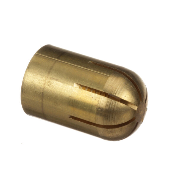 A close-up of a Groen brass gas jet orifice cap with a hole in it.