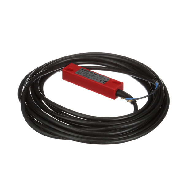 A black cord with a red plug and a black box with a red label.