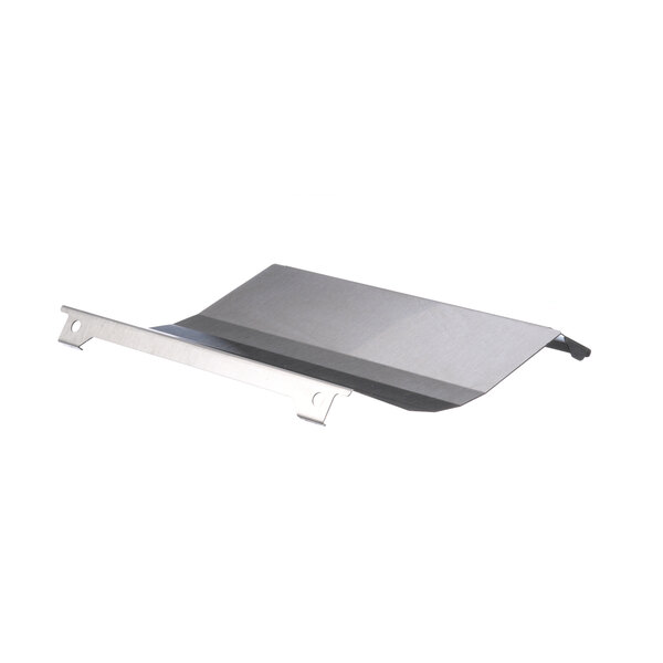 A silver metal tray with a handle on a grey rectangular object.