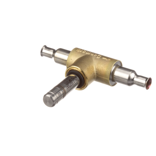 A brass Danfoss solenoid valve for a capillary tube with a metal tool.