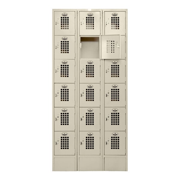 A white Winholt locker with perforated doors and eighteen compartments.