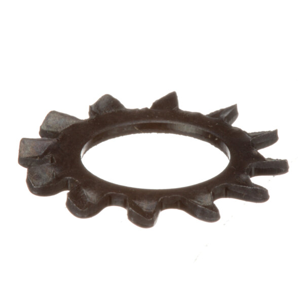 A close-up of a black metal gear wheel with spikes.