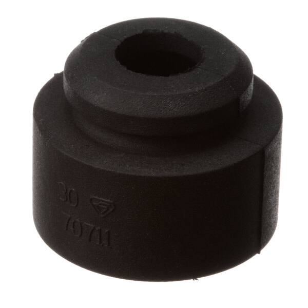 A black round Master-Bilt grommet with a hole in it.