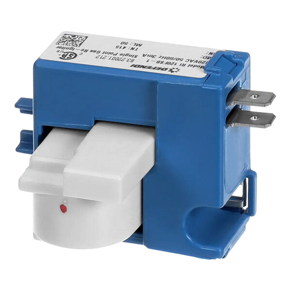A close up of a Jade Range ignition module with a blue and white device.