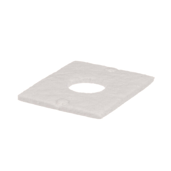 A white square insulation gasket with a hole in it.