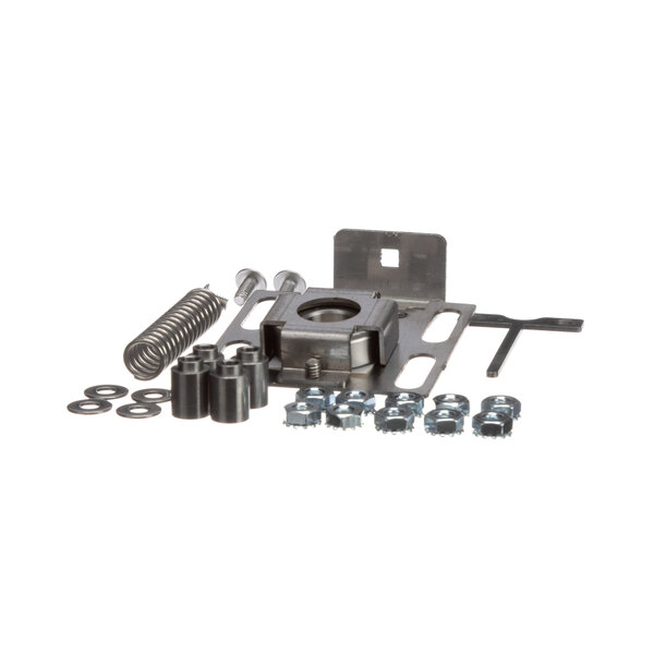 An Antunes tensioner kit on a table with nuts, bolts and screws.
