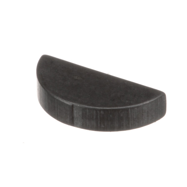 A close-up of a black plastic Frymaster woodruff key.