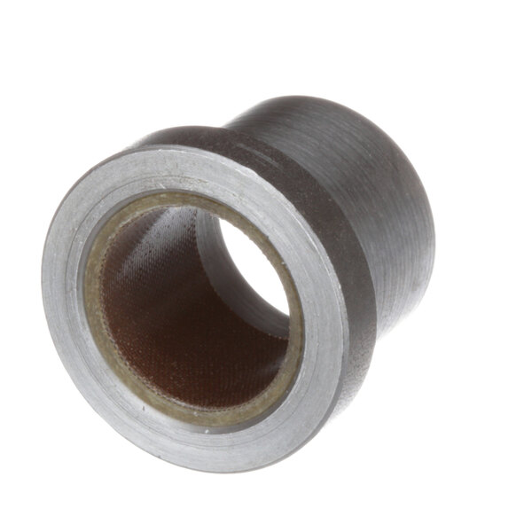 A Bakers Pride metal bushing with a small hole in it.