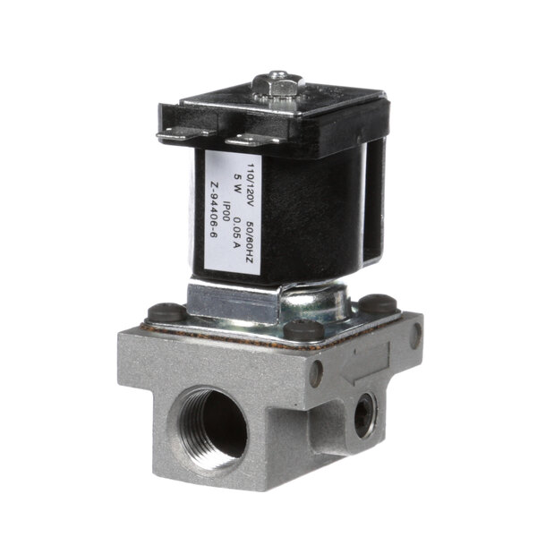 A mechanical gas valve with a white label on a black cover.