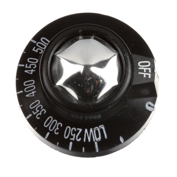 A black and silver knob with white text.