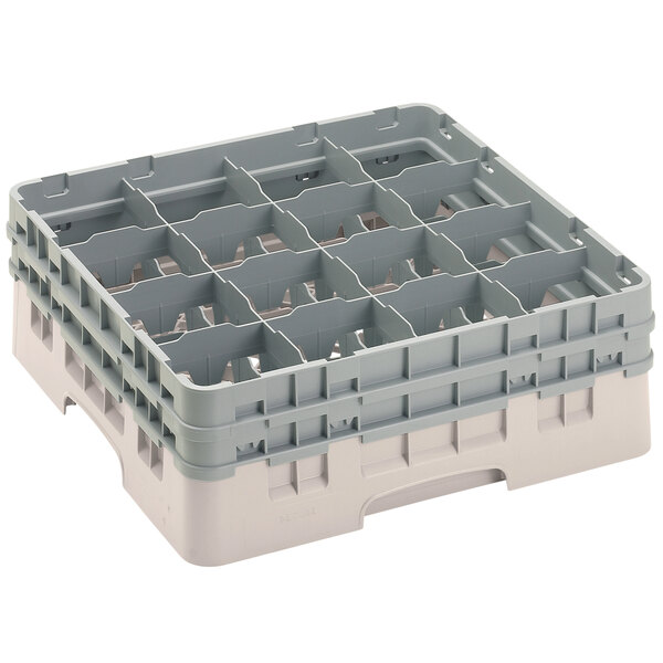 A white plastic Cambro glass rack with 16 compartments.