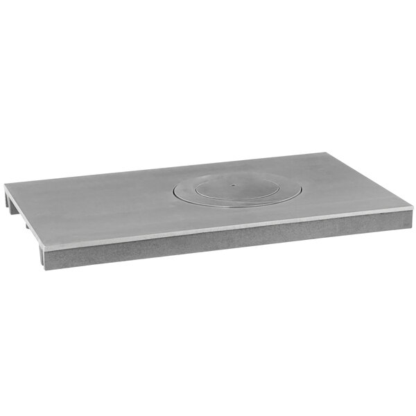 A grey rectangular Jade Range hot top plate with a circular hole in the middle.