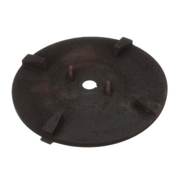 A black circular metal face plate with four holes.