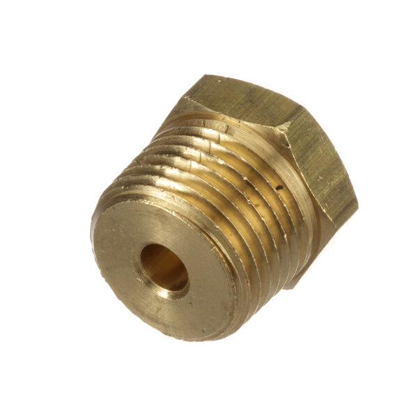 A close-up of a brass circular threaded nut.