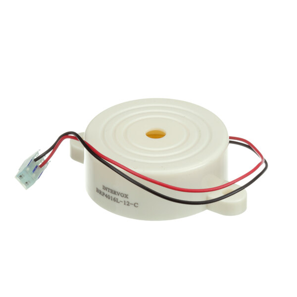 A white round Baxter alarm piezo pre-wired with black and red wires.