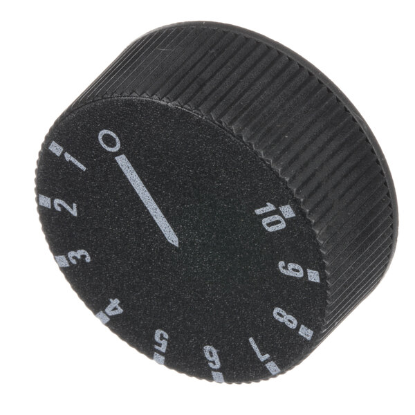A black Groen thermostat knob with white numbers.