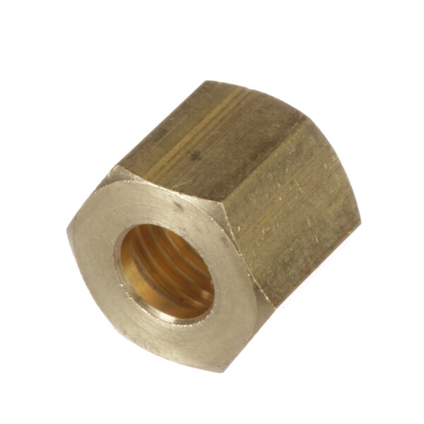 A close-up of a brass hexagon nut.