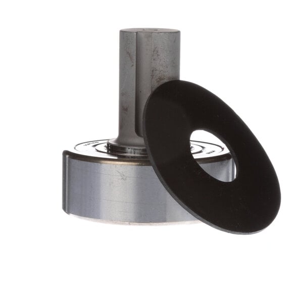 A metal cylinder with a black rubber ring on top.